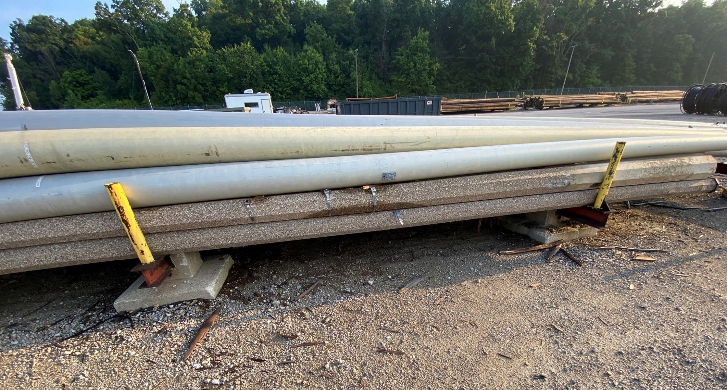 Assortment of Fiberglass and Concrete Poles