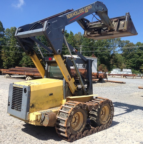 2001 New Holland Skidsteer LS180 with 4-in-1 Bucket and Steel Track (980148)